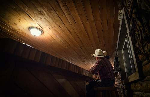 idaho man sitting on chair while looking up night